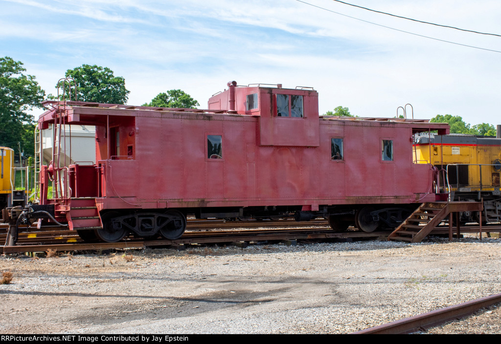 A caboose sits next to the Sequatchie Valley RR Office 